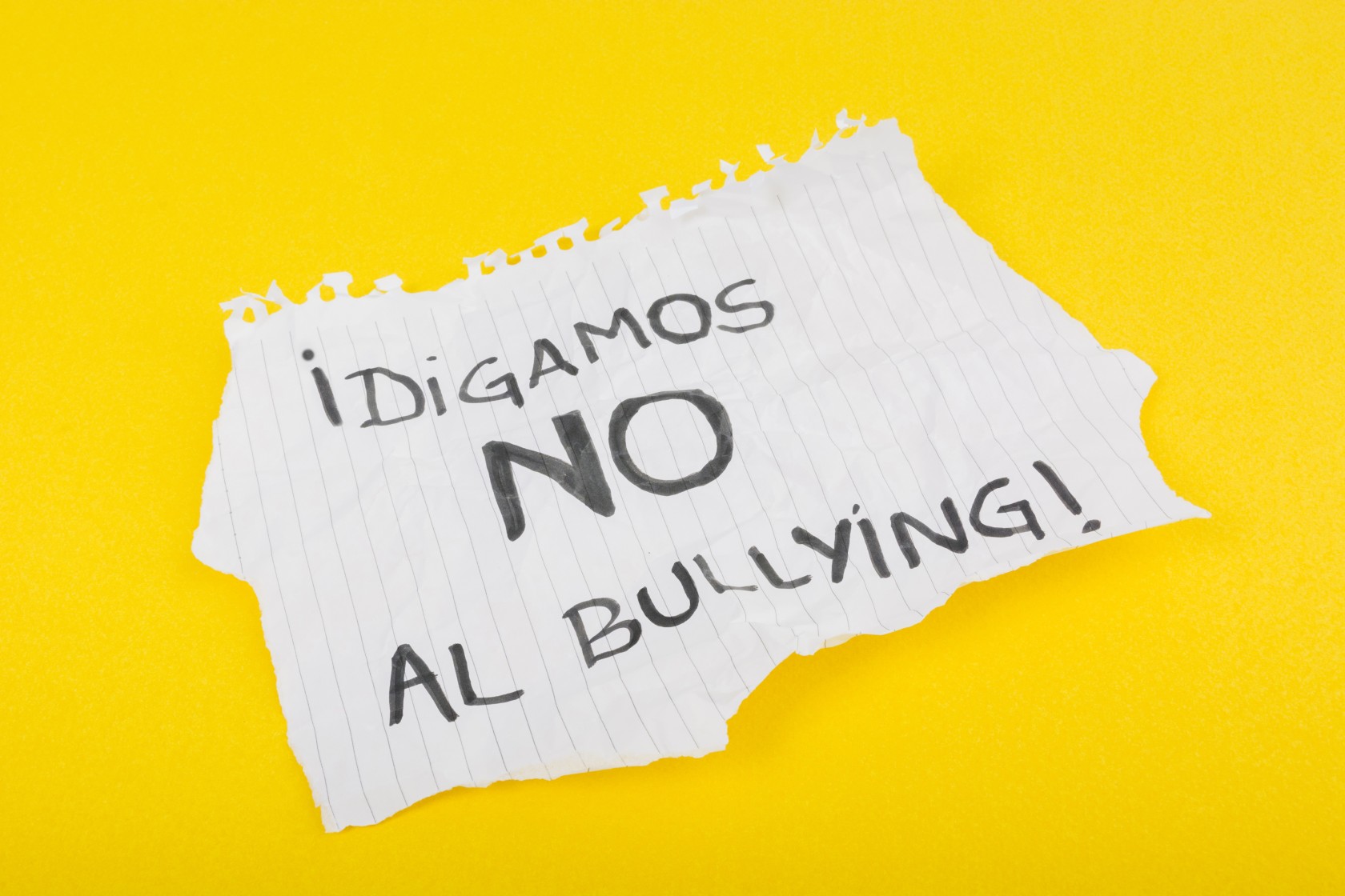 spanish-slogan-on-paper-sheet-against-bullying.jpg